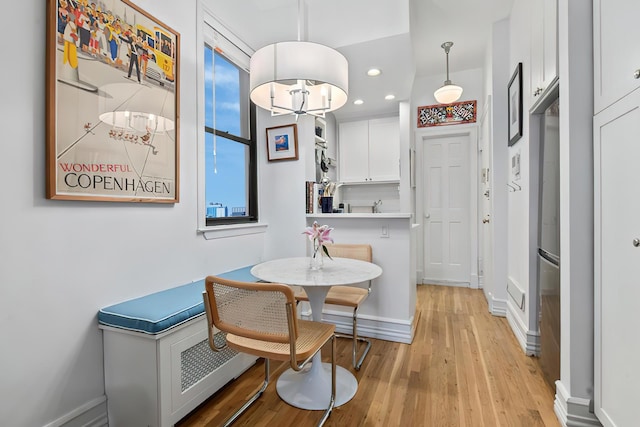252 W 20th St Unit 3B, New York City, NY 10011 - dining area featuring light wood finished floors, recessed lighting, and a chandelier