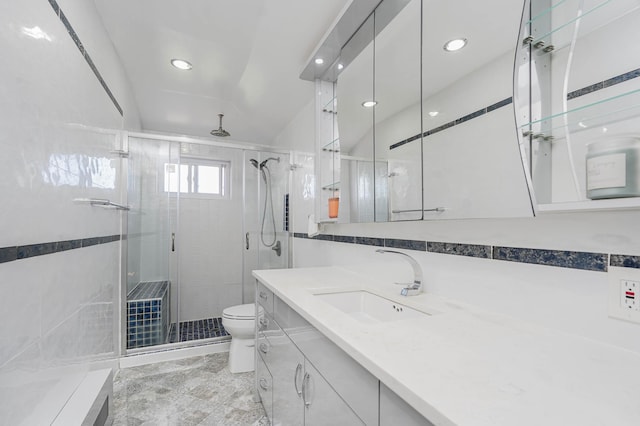 full bathroom featuring a shower stall, vanity, toilet, and recessed lighting