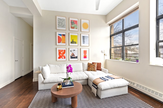 living area featuring wood finished floors and baseboards