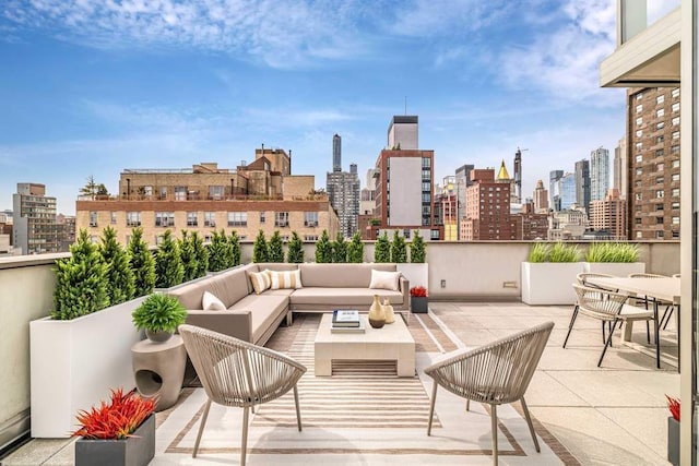 view of patio featuring a city view and outdoor lounge area