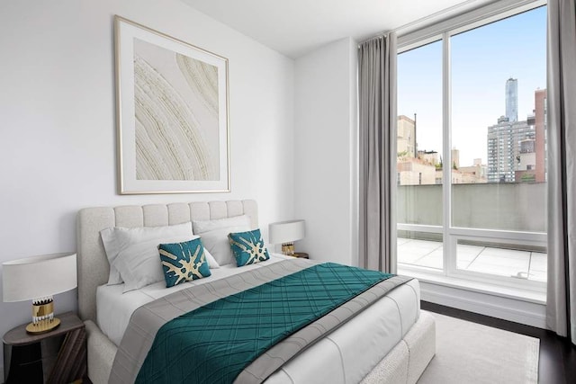 bedroom featuring a city view