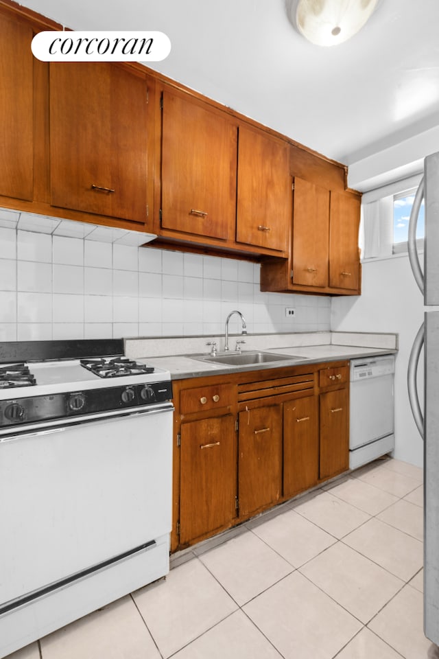 185 Park Row Unit 17F, New York City, NY 10038 - kitchen featuring white appliances, a sink, and brown cabinets