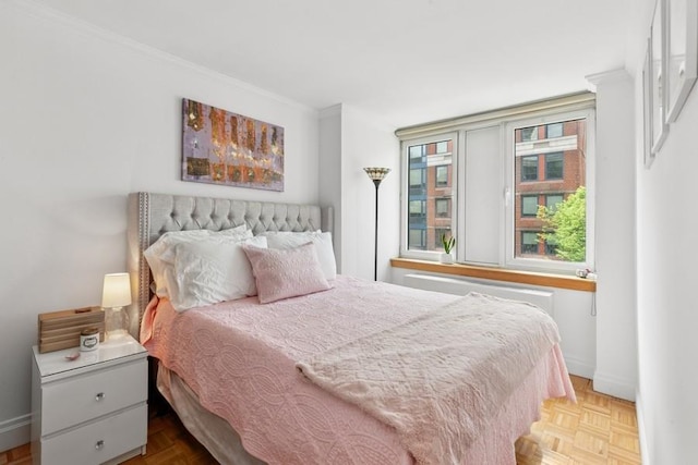 404 E 76th St Unit 4-O, New York City, NY 10021 - bedroom with crown molding and baseboards