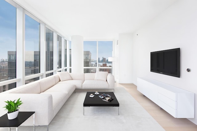 15 Hudson Yards Unit 31A, New York City, NY 10001 - living room with light wood-style flooring and a wall of windows