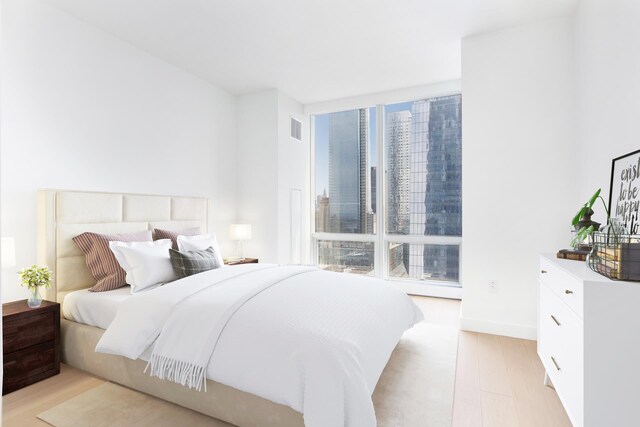 15 Hudson Yards Unit 31A, New York City, NY 10001 - bedroom with light wood-style flooring and baseboards