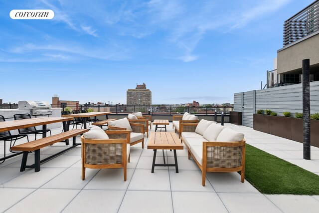 428 E 9th St Unit 411, New York City, NY 11218 - balcony with outdoor lounge area, a patio, a city view, and grilling area