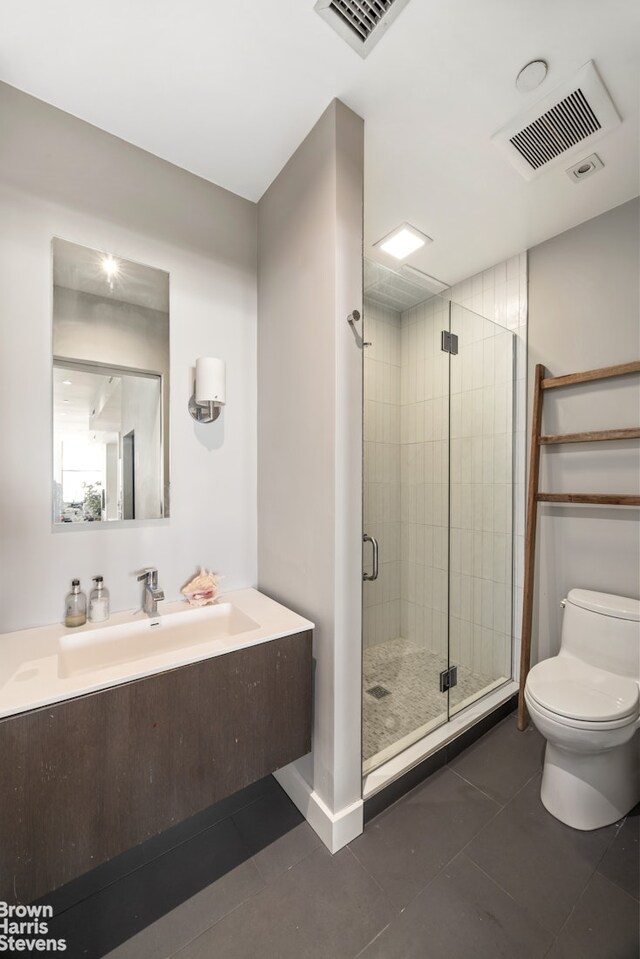bathroom featuring toilet, visible vents, tile patterned flooring, and a stall shower