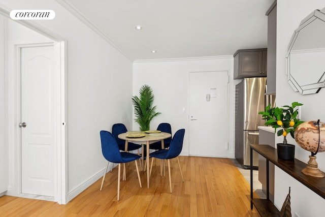 61 W 62nd St Unit 27G, New York City, NY 10023 - dining room with light wood finished floors, crown molding, and recessed lighting