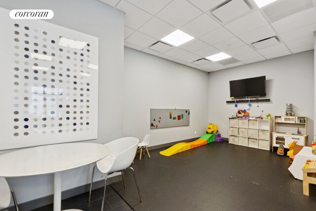 61 W 62nd St Unit 27G, New York City, NY 10023 - recreation room featuring a paneled ceiling