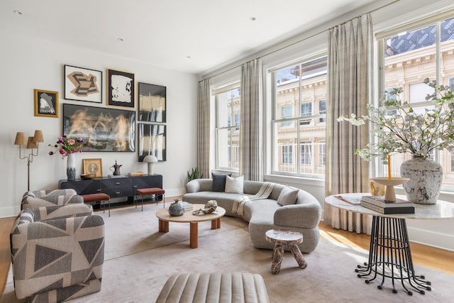 sitting room featuring baseboards and wood finished floors