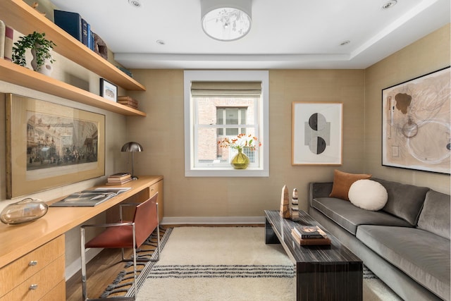 interior space with baseboards and wood finished floors