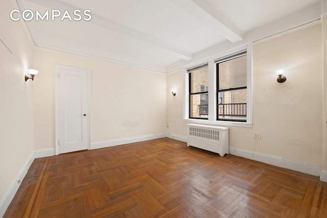 20 W 72nd St Unit 1403, New York City, NY 10023 - unfurnished room featuring radiator heating unit, beam ceiling, and baseboards