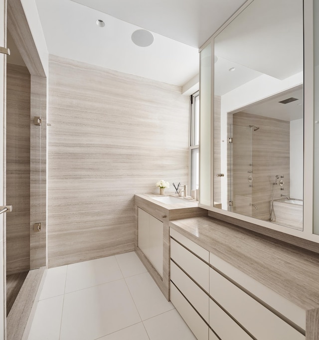 71 Park Ave Unit 10-A, New York City, NY 10016 - bathroom with tile patterned floors, vanity, and a shower with door