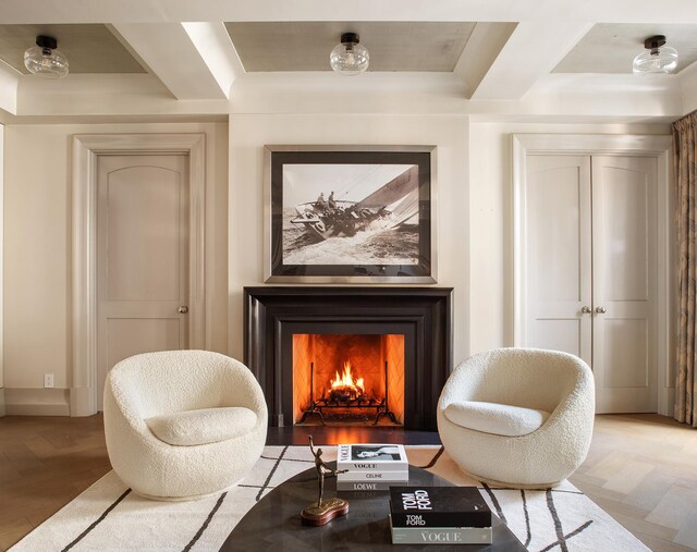 71 Park Ave Unit 10-A, New York City, NY 10016 - living area featuring a lit fireplace and wood finished floors