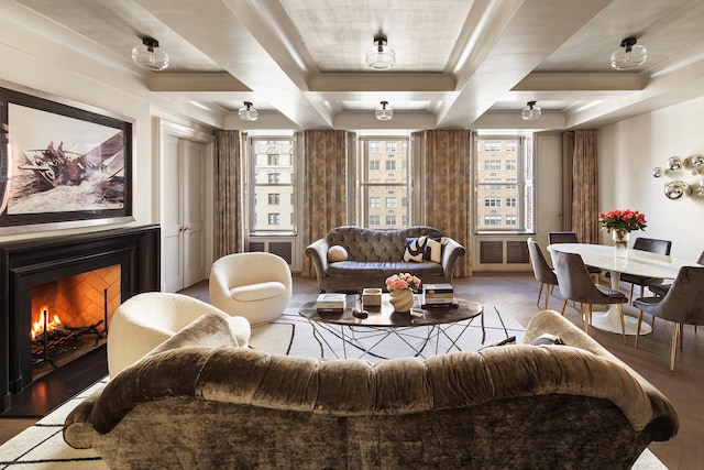 71 Park Ave Unit 10-A, New York City, NY 10016 - living area with a warm lit fireplace, wood finished floors, and coffered ceiling