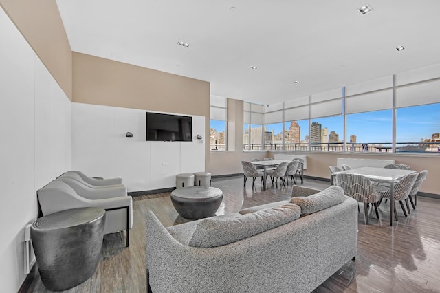 425 Main St Unit 4-C, New York City, NY 10044 - living area with healthy amount of natural light, wood finished floors, baseboards, and recessed lighting