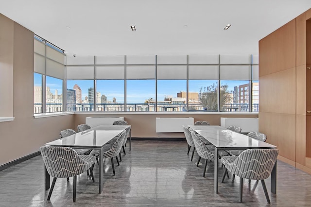 425 Main St Unit 4-C, New York City, NY 10044 - dining space featuring a view of skyline and baseboards