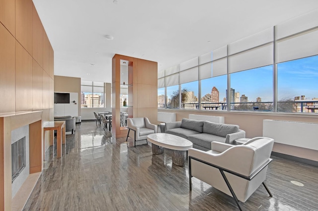 425 Main St Unit 4-C, New York City, NY 10044 - living area with wood finished floors and a fireplace