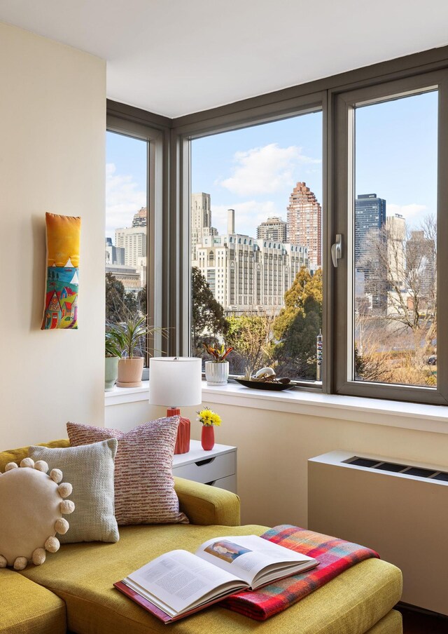 425 Main St Unit 4-C, New York City, NY 10044 - sitting room featuring a view of city and radiator heating unit