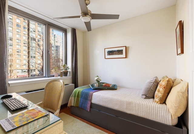 425 Main St Unit 4-C, New York City, NY 10044 - bedroom with wood finished floors and a ceiling fan