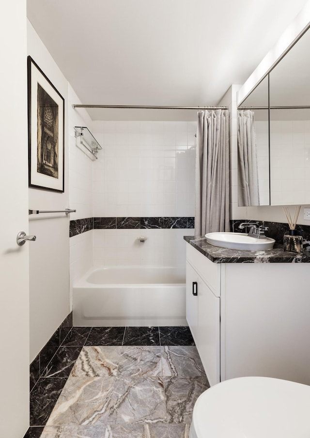 425 Main St Unit 4-C, New York City, NY 10044 - full bathroom featuring toilet, vanity, shower / tub combo with curtain, and marble finish floors