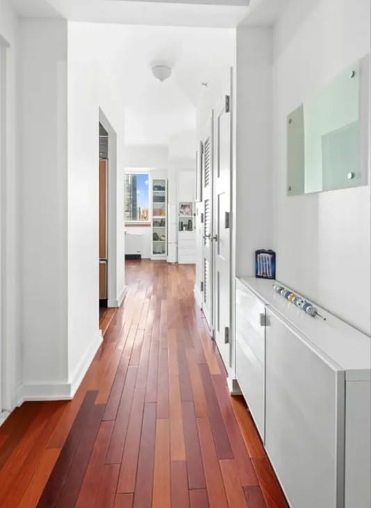 hall with dark wood-type flooring