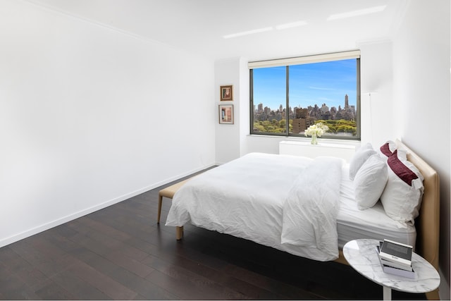 225 W 60th St Unit 14E, New York City, NY 10023 - bedroom with wood finished floors and ornamental molding