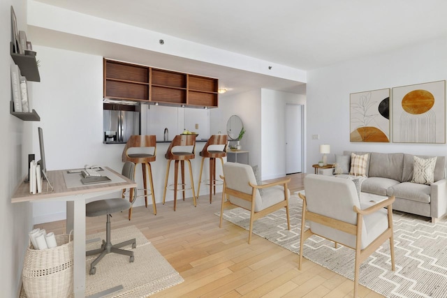 225 W 60th St Unit 14E, New York City, NY 10023 - living room featuring light wood-style flooring and an office area