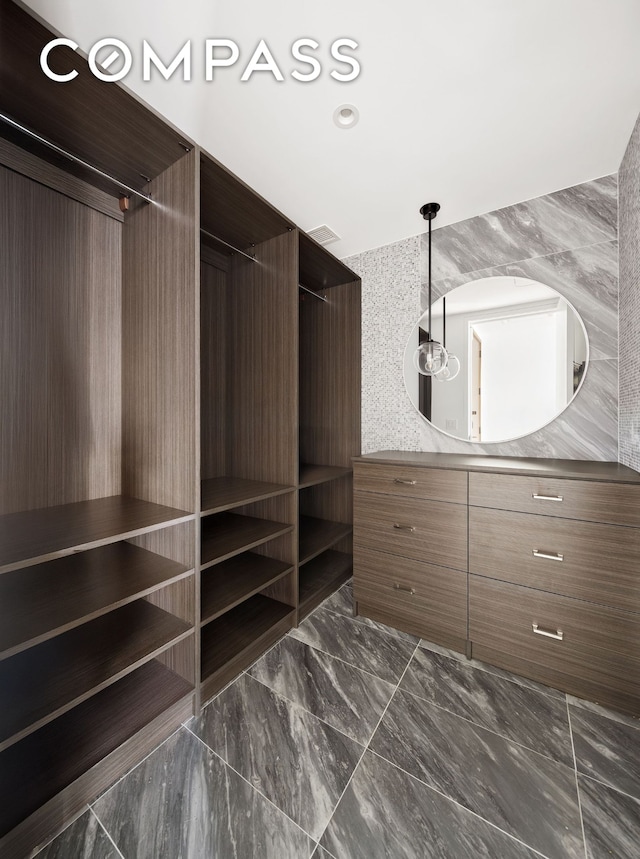 30 Riverside Blvd Unit 33D, New York City, NY 10069 - walk in closet featuring dark marble finish flooring