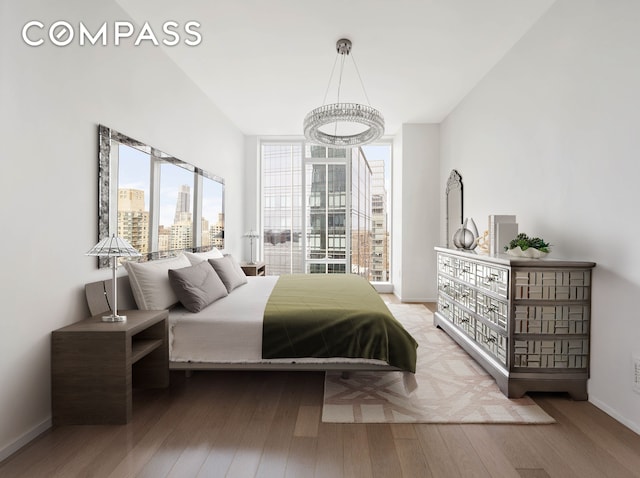 30 Riverside Blvd Unit 33D, New York City, NY 10069 - bedroom with wood finished floors, a city view, and floor to ceiling windows