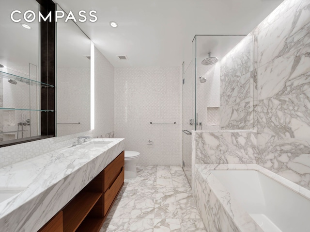 30 Riverside Blvd Unit 33D, New York City, NY 10069 - bathroom with a marble finish shower, double vanity, a garden tub, tile walls, and marble tiled floors