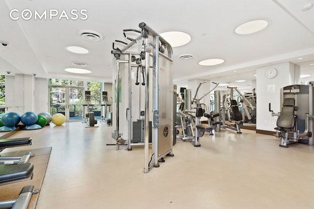 gym featuring recessed lighting, floor to ceiling windows, and visible vents