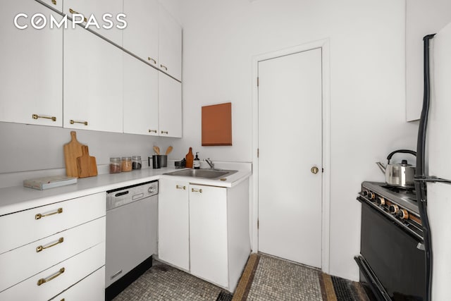 874 Broadway Unit 907, New York City, NY 10003 - kitchen featuring dishwashing machine, a sink, gas range, freestanding refrigerator, and light countertops