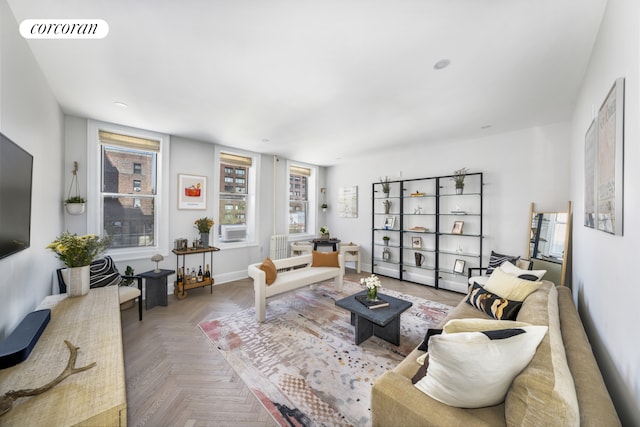 324 E 50th St Unit 6D, New York City, NY 10022 - living room featuring plenty of natural light and cooling unit