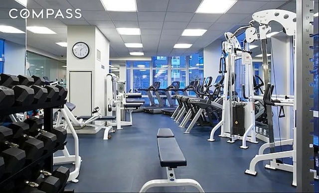workout area featuring a paneled ceiling