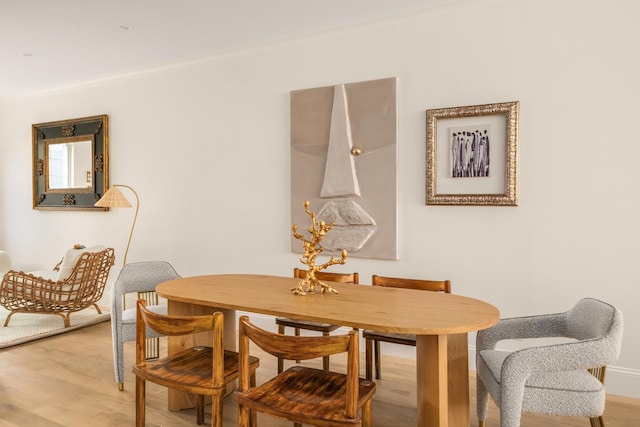 38 Garfield Place, New York City, NY 11215 - dining area with ornamental molding, light wood finished floors, and baseboards