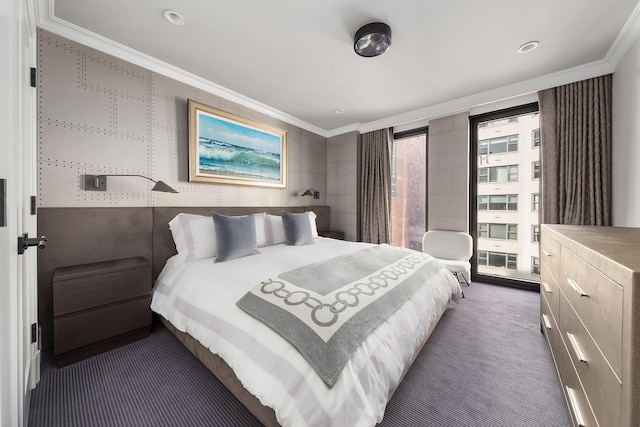 carpeted bedroom with crown molding and floor to ceiling windows