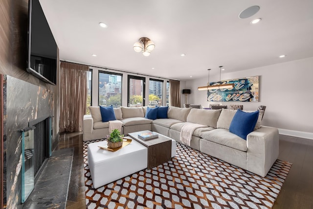 living room with baseboards, a fireplace, recessed lighting, and hardwood / wood-style floors
