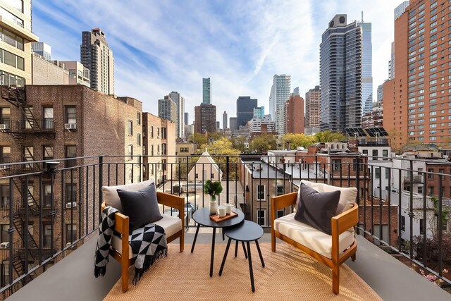 230 E 63rd St Unit 6, New York City, NY 10065 - balcony featuring a skyline view