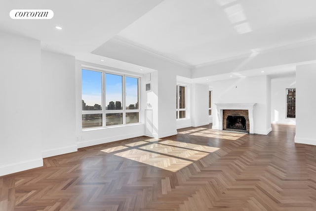 unfurnished living room featuring recessed lighting, baseboards, visible vents, and a fireplace with flush hearth