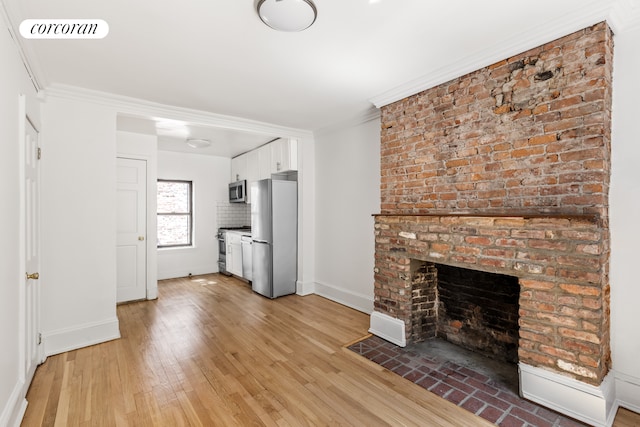 113 W 15th St Unit 1E, New York City, NY 10011 - unfurnished living room featuring baseboards, light wood-type flooring, ornamental molding, and a fireplace