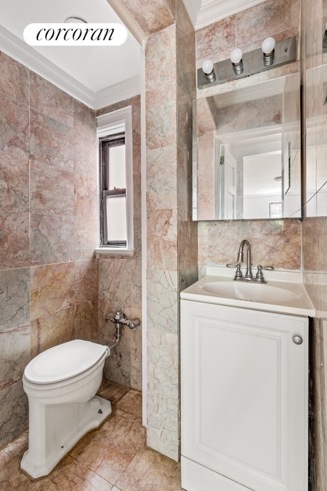 113 W 15th St Unit 1E, New York City, NY 10011 - half bathroom with tile walls, toilet, crown molding, and vanity