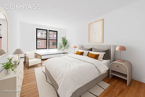337 E 50th St Ph-E, Ph-E New York City, NY 10022 - bedroom featuring light wood finished floors and multiple windows
