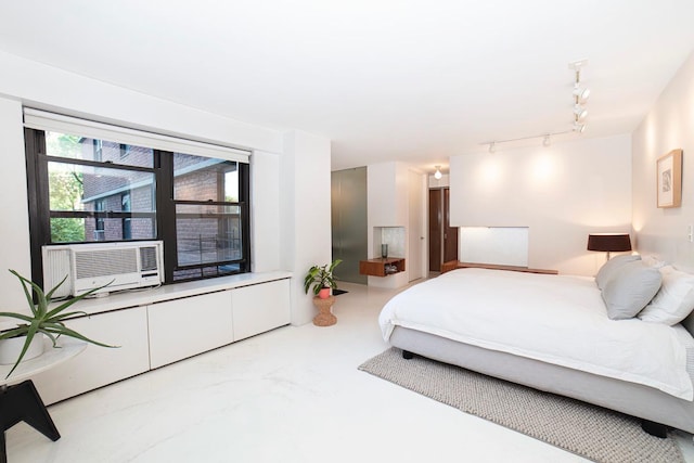 bedroom featuring cooling unit and rail lighting