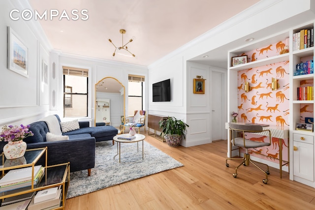 living room featuring ornamental molding and wood finished floors