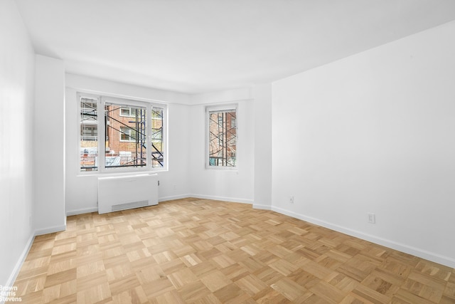 60 Sutton Pl S Unit 3Kn, New York City, NY 10022 - empty room featuring radiator and baseboards