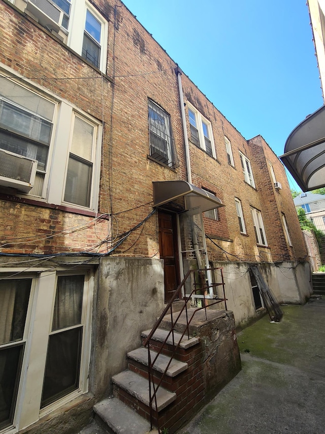 view of building exterior with cooling unit