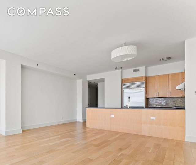 545 W 110th St Unit 5A, New York City, NY 10025 - unfurnished living room featuring light wood-type flooring and baseboards