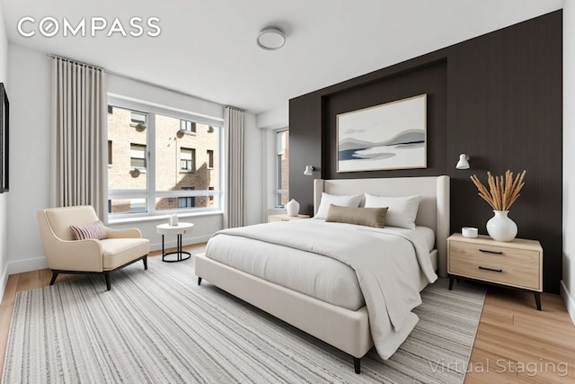 545 W 110th St Unit 5A, New York City, NY 10025 - bedroom featuring wood finished floors and baseboards