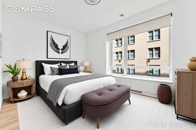 545 W 110th St Unit 5A, New York City, NY 10025 - bedroom featuring light wood-type flooring and baseboards